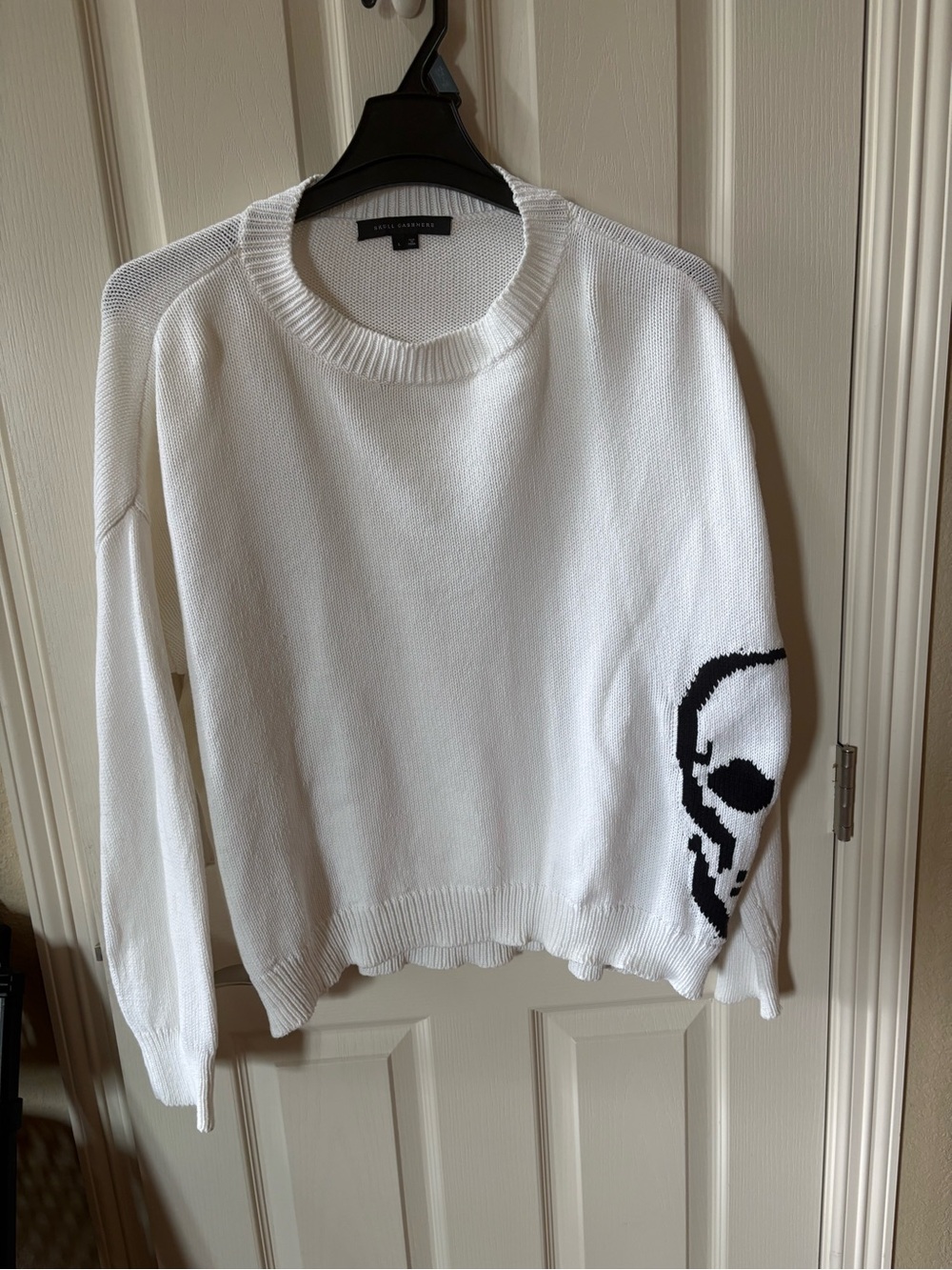 Women’s oversized White Crewneck Sweater with Black Skull Sleeve. Size Large